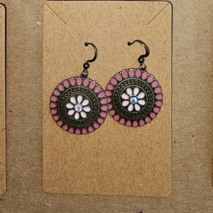 Pink colored round boho earrings